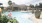 large potted plants around pool