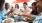 a group of people eating at a table