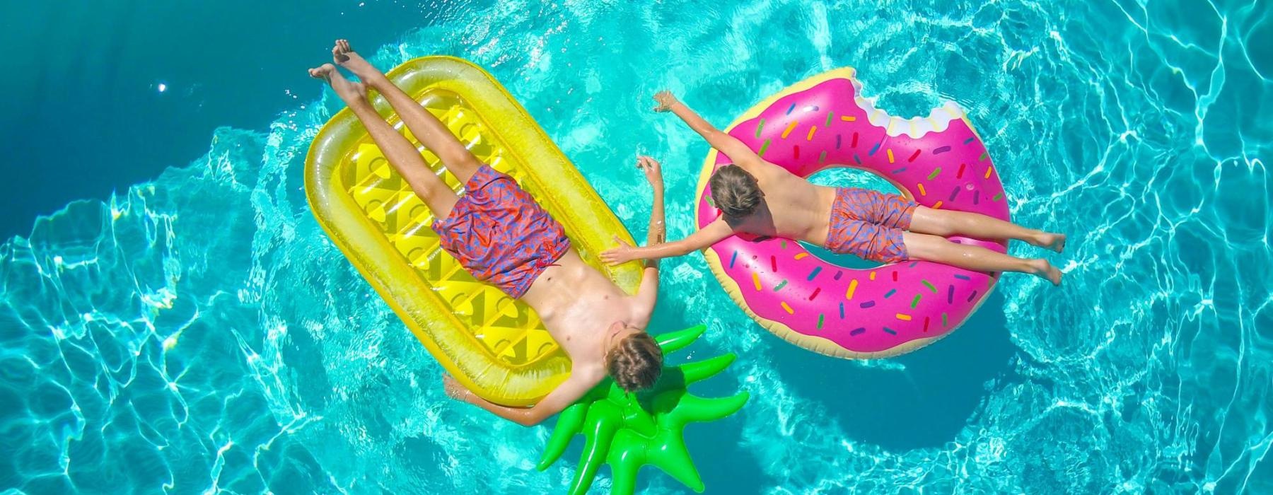 people on floaties in a pool