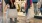 people holding shopping bags in a mall