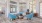 a room with blue chairs and a rug